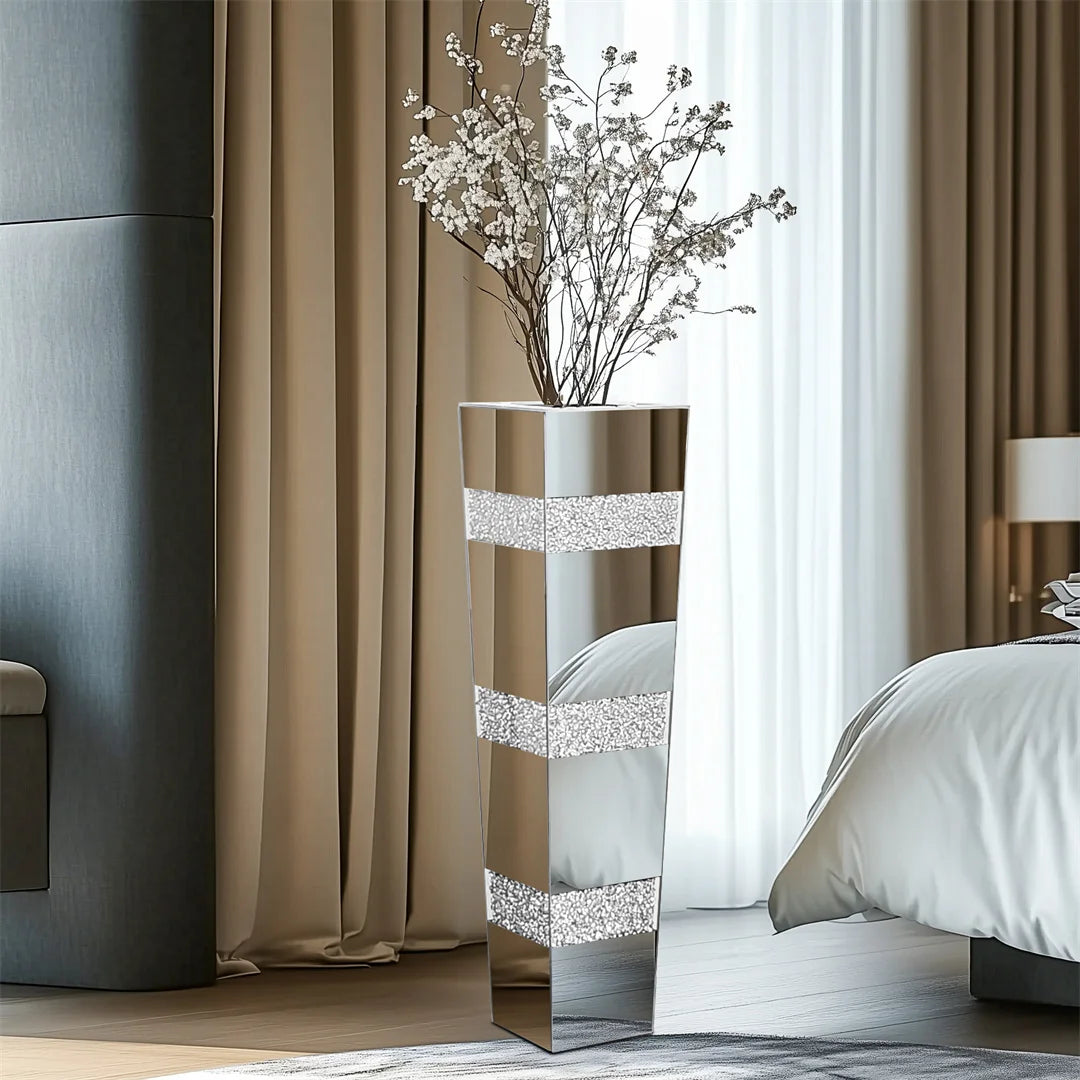 Decorative mirrored stand with flowers in a bedroom setting