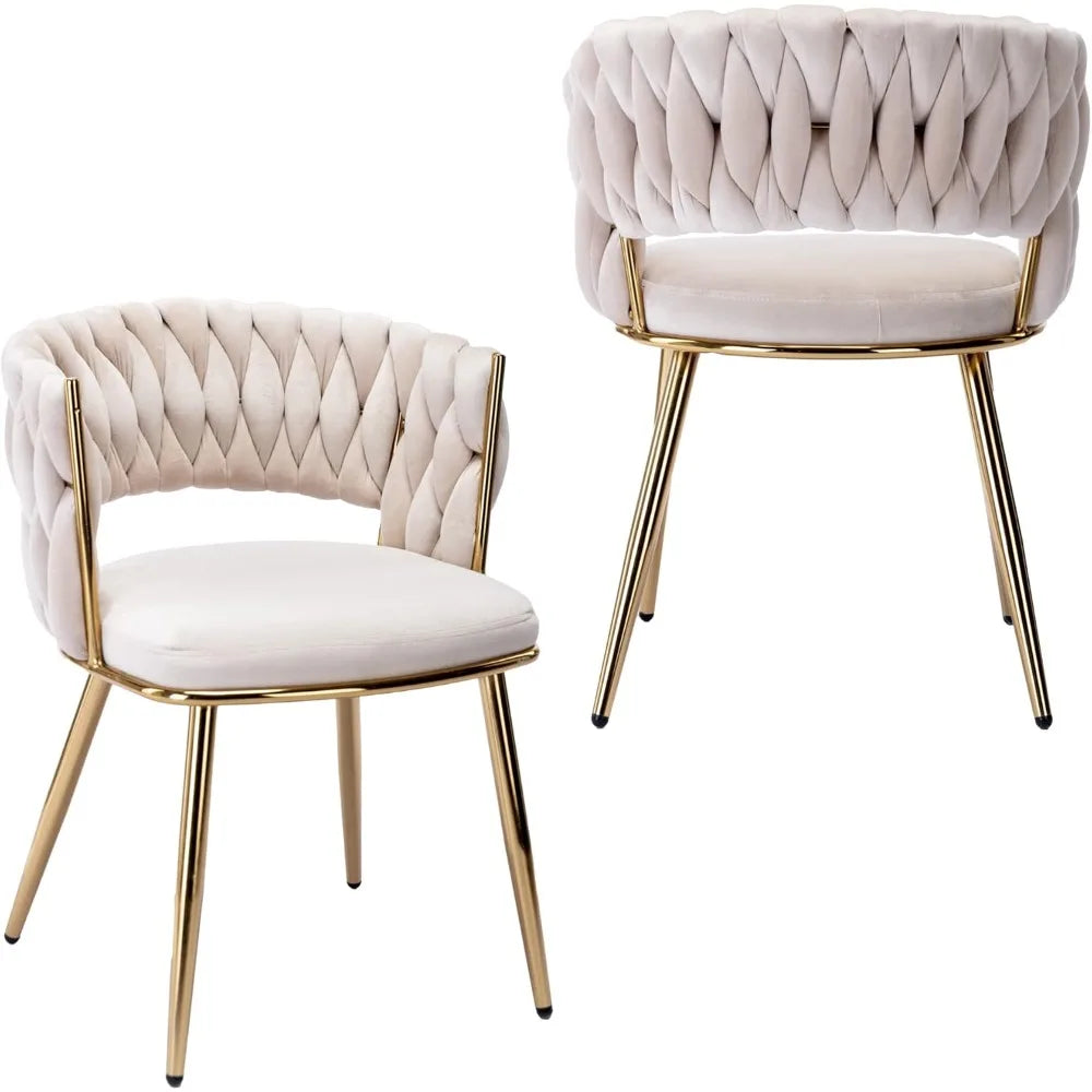 Two beige tufted chairs with gold legs on a white background