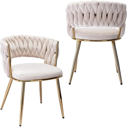 Two beige tufted chairs with gold legs on a white background