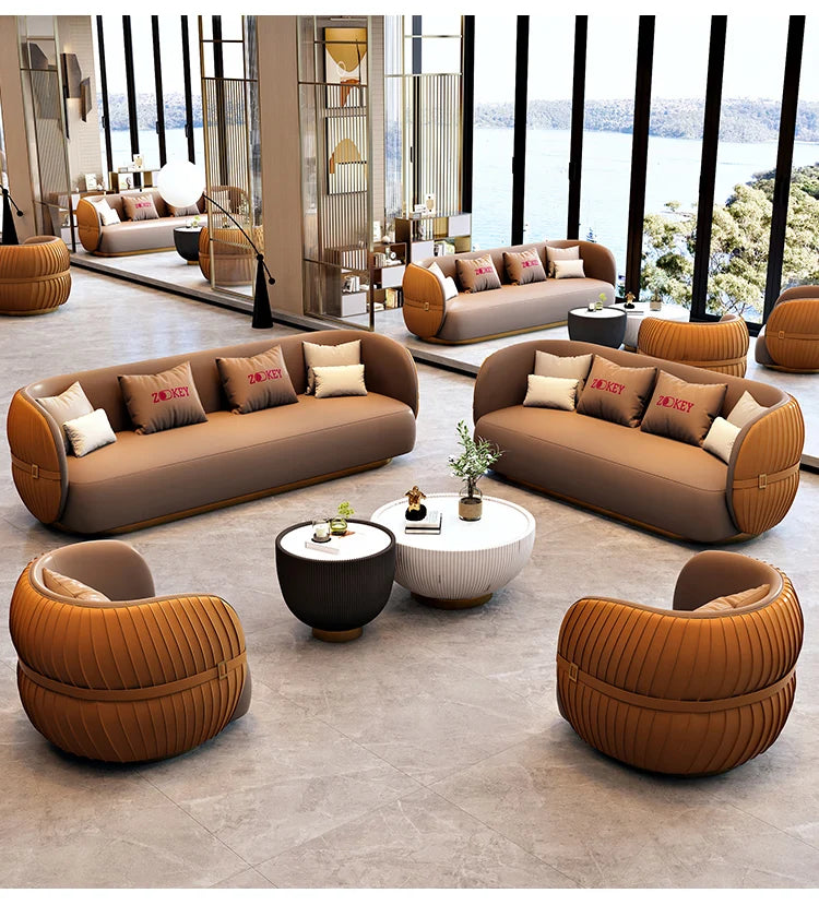 Modern living room with brown and orange sofa set and coffee table.
