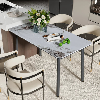 Dining table with marble-like surface and chairs in a modern kitchen setting
