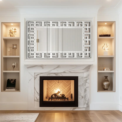 Modern living room with a fireplace, decorative mirror, and built-in shelves.