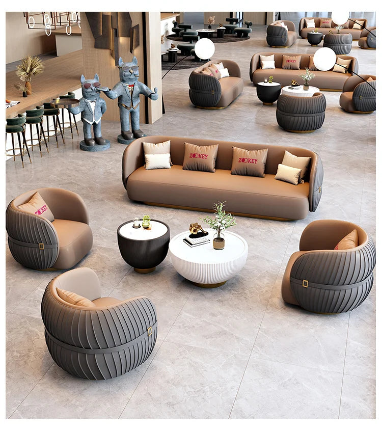 Modern living room with brown and gray furniture set on a light gray floor.