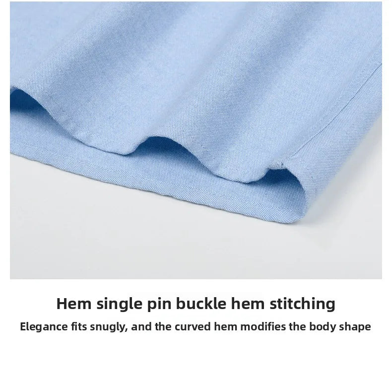 Close-up of blue fabric with a hem and text describing stitching details.
