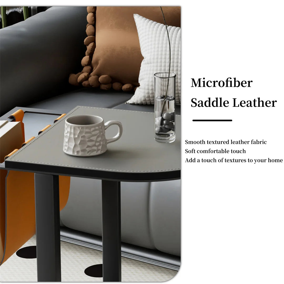 Gray table with a white mug and glass against a sofa background, featuring microfiber saddle leather.