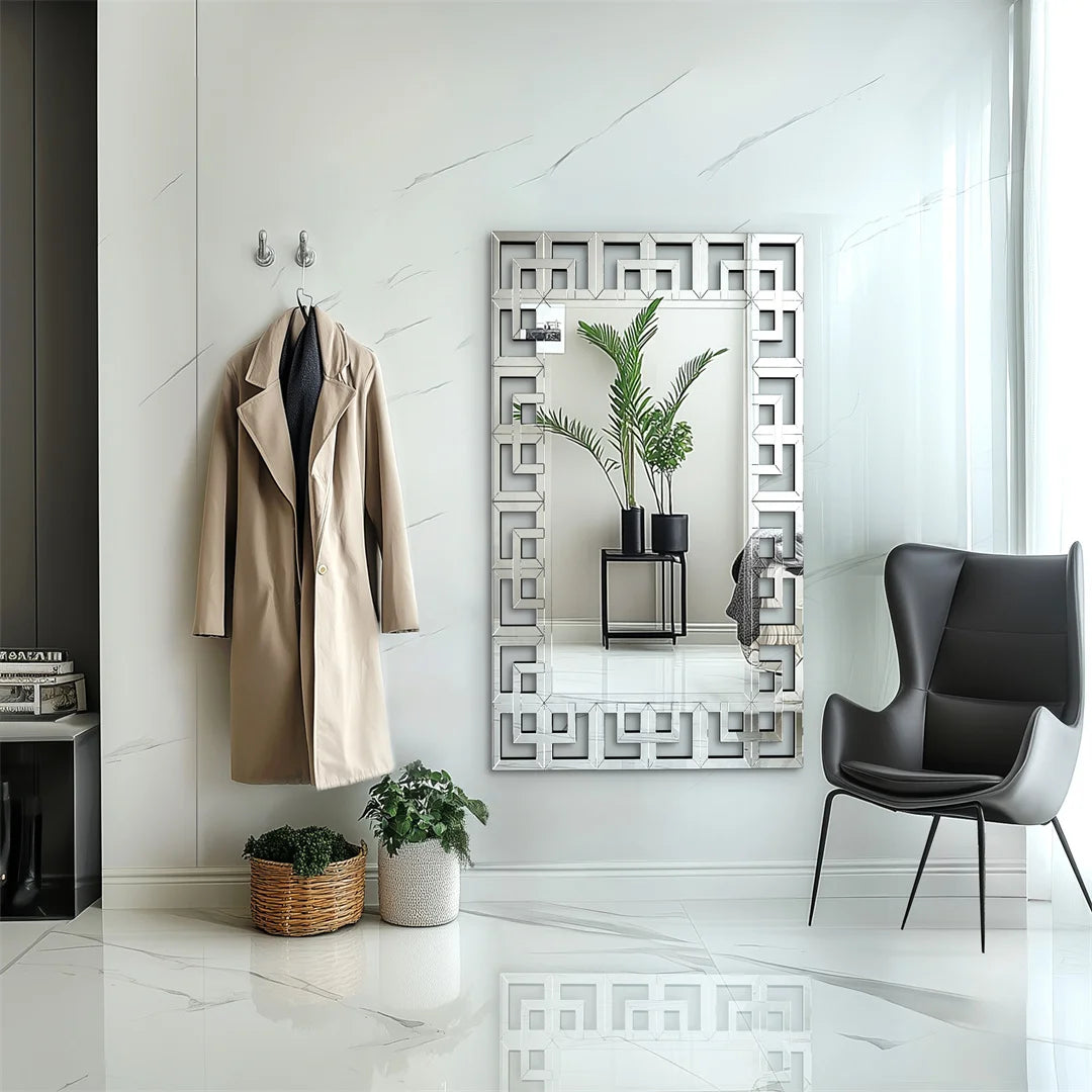 Modern interior with a coat hanging on a hook, decorative mirror, and a chair.