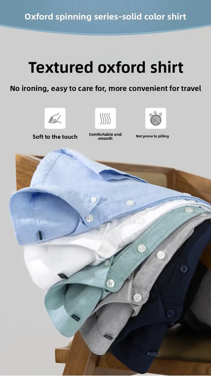 Stack of textured oxford shirts on a wooden surface with product features listed.