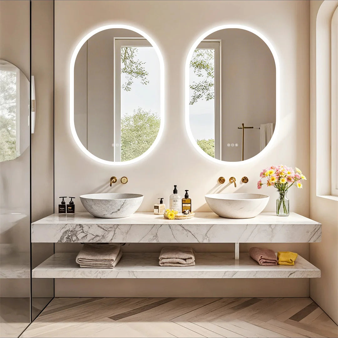 Modern bathroom with double vanity, round mirrors, and decorative elements.