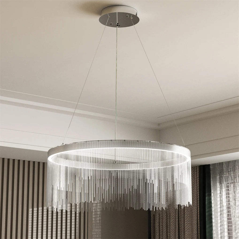 Modern chandelier hanging from the ceiling in a room with striped walls.