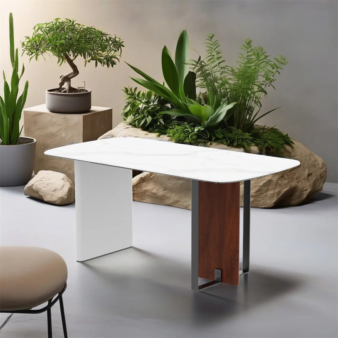 Modern white table with wooden leg in a room with plants and rocks