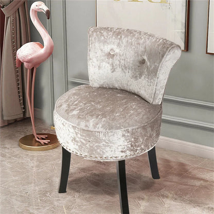 Silver glittery chair with a pink flamingo decoration in a room.