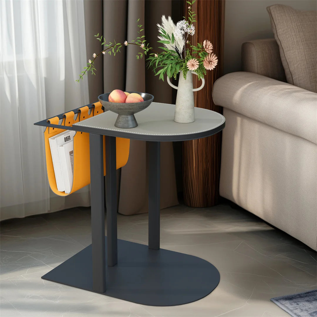 Small round table with decorative items in a living room setting