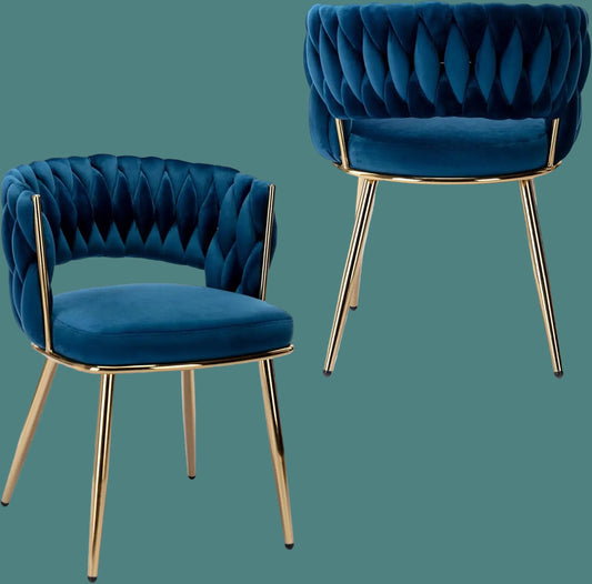 Two blue velvet chairs with gold legs on a white background