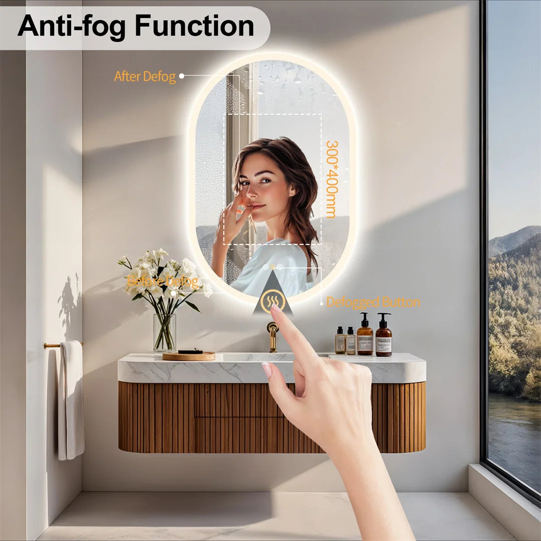 Person using an anti-fog mirror in a bathroom with a view of nature outside.