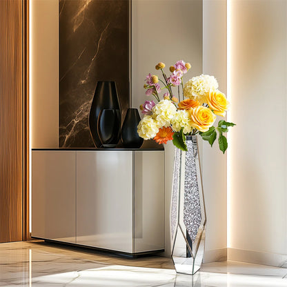 Decorative vase with flowers next to a modern cabinet in a stylish interior setting.